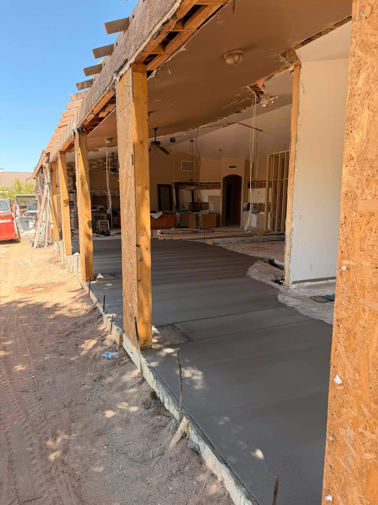 Interior concrete floor pour during a home remodel